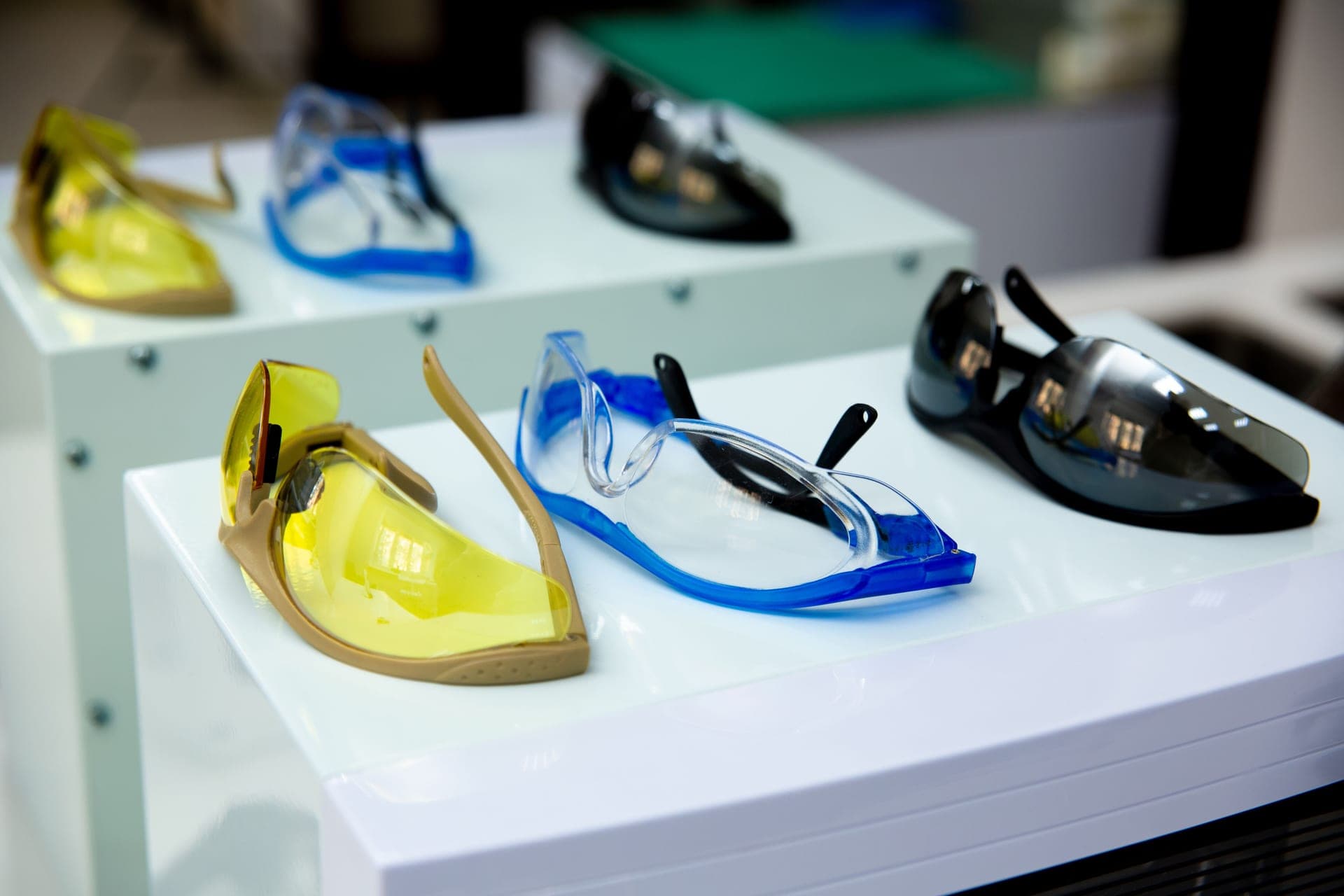Illustrative stock photo: protective eyewear in yellow, blue and black on a display